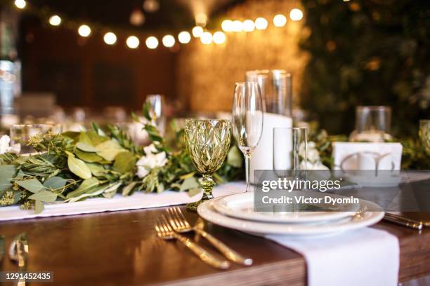 luxurious service on the decorated table in the restaurant - man proposing indoor stock-fotos und bilder