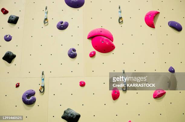 a colorful rock-climbing interior - bouldern indoor stock pictures, royalty-free photos & images