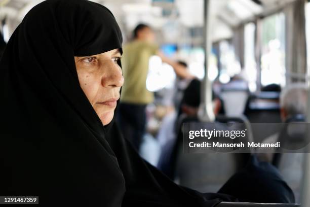 iranian muslim woman in the bus - tehran people stock pictures, royalty-free photos & images