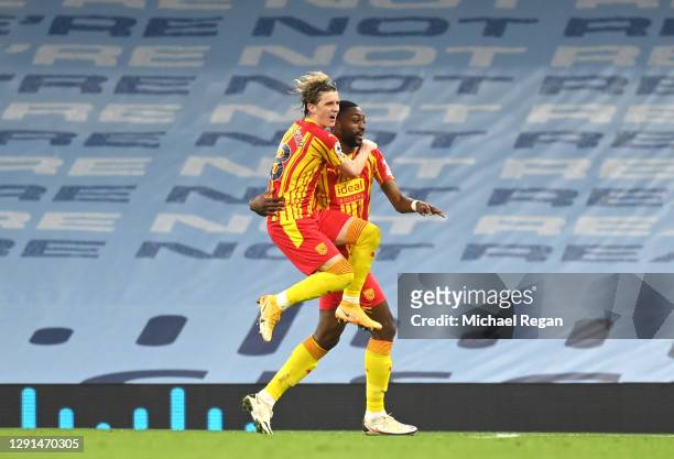 Semi Ajayi of West Bromwich Albion celebrates with teammate Conor Gallagher after his sides first goal which came from a Ruben Dias of Manchester...