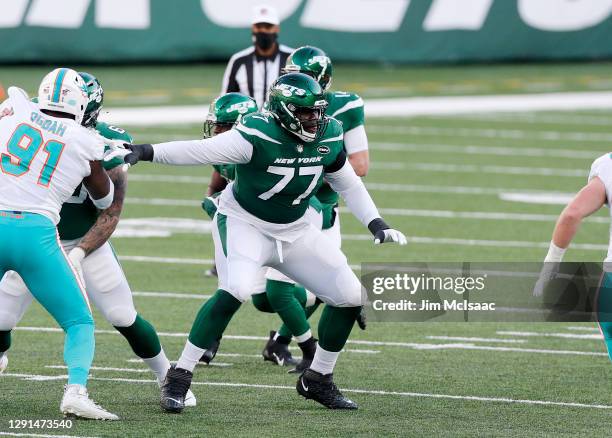 Mekhi Becton of the New York Jets in action against the Miami Dolphins at MetLife Stadium on November 29, 2020 in East Rutherford, New Jersey. The...