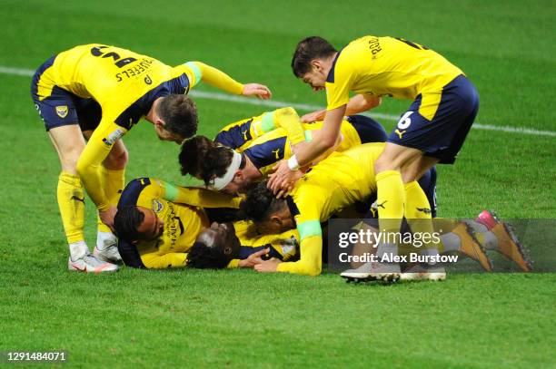 Daniel Agyei of Oxford United celebrates with teammates after scoring their team's fourth goal during the Sky Bet League One match between Oxford...