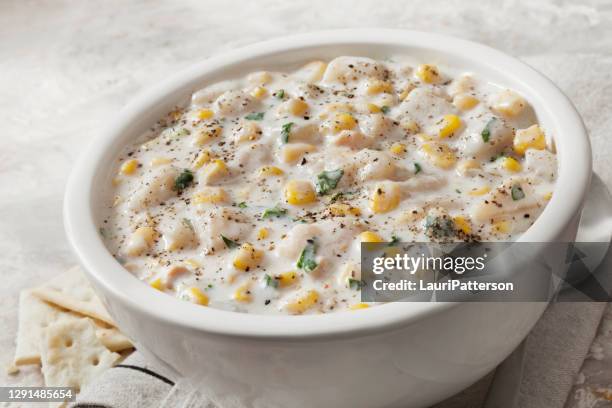 creamy corn and potato chowder with saltine crackers - chowder stock pictures, royalty-free photos & images