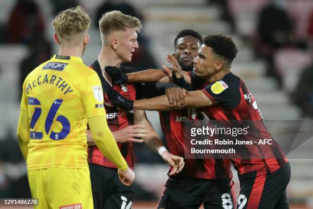 Jefferson Lerma of Bournemouth steps in between Sam Surridge and Junior Stanislas after frustration got the better of them during the Sky Bet...