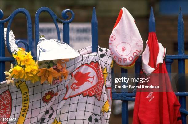 Liverpool team memorabilia hangs from a fence in tribute after the disaster at Hillsborough in Sheffield, England. \ Mandatory Credit: Pascal...