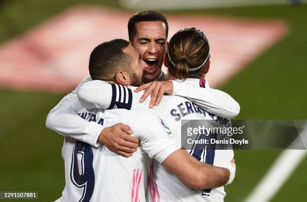 Karim Benzema of Real Madrid celebrates with Lucas Vazquez and Sergio Ramos after scoring his sides second goal during the La Liga Santander match...