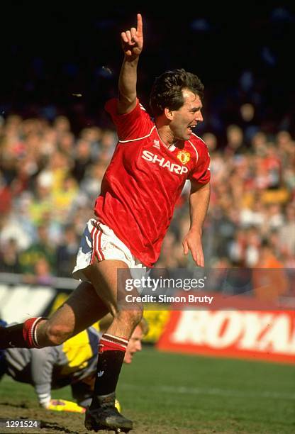 Bryan Robson of Manchester United celebrates after scoring the first goal during the FA Cup Semi-Final against Oldham at Maine Road in Manchester,...