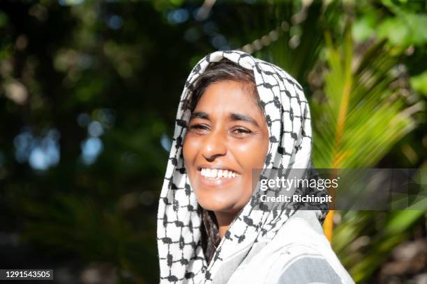 smiling in the sunlight - kaffiyeh stock pictures, royalty-free photos & images