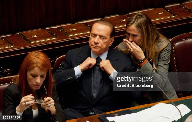 Michela Brambilla, Italy's tourism minister, left, Silvio Berlusconi, Italy's prime minister, center, and Stefania Prestigiacomo, Italy's environment...