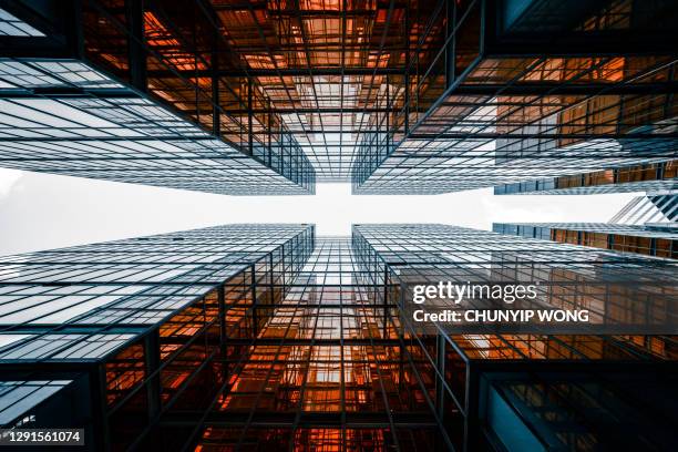 looking directly up at the skyline of the financial district - commercial property imagens e fotografias de stock