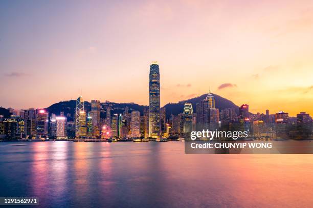 hong kong financial district at twilight - victoria hong kong stock pictures, royalty-free photos & images