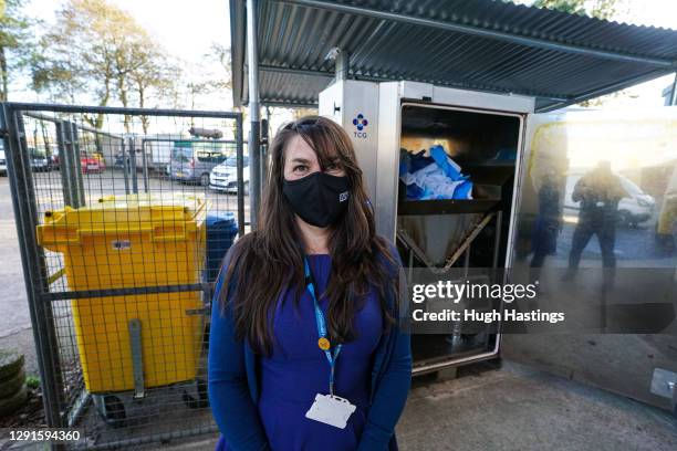 Roz Davies, General Manager Specialist Systems Services and Surgery, poses for the photographer in front of the hospital"u2019s new waste recycling...