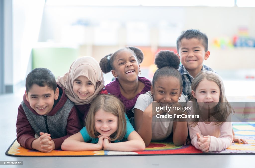 Multi ethnic preschool children smiling