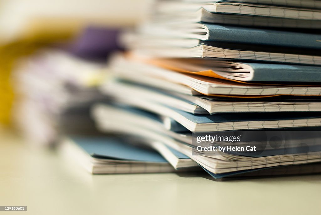 Pile of exercise books
