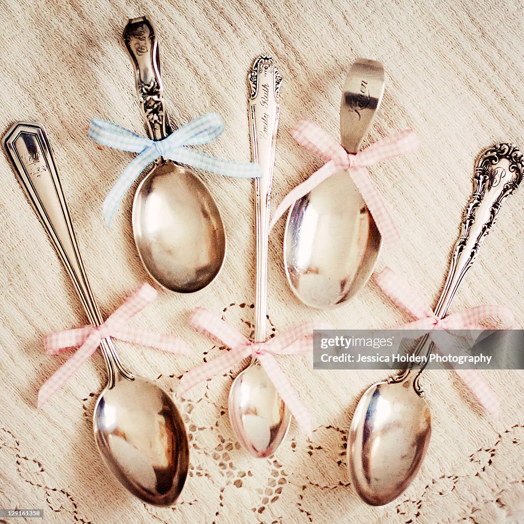 Generations of antique silver baby spoons