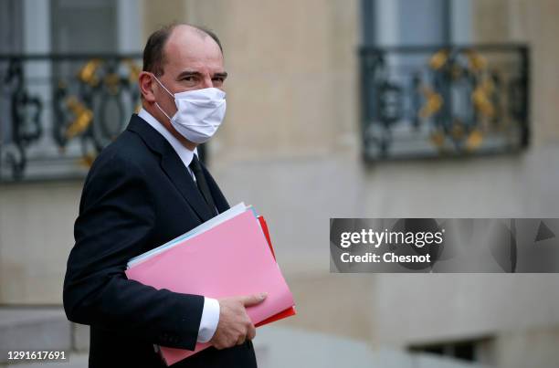 French Prime Minister, Jean Castex wearing a protective face mask leaves the Elysee presidential Palace after a weekly cabinet meeting on December...