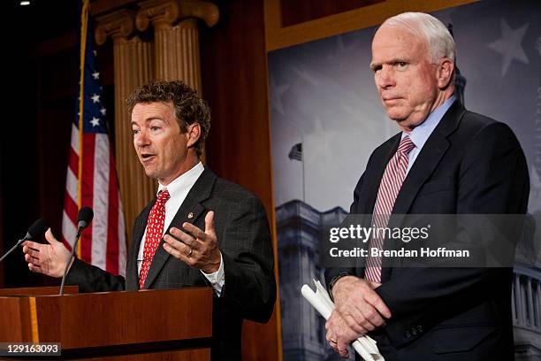 Sen. Rand Paul speaks as Sen. John McCain looks on at a news conference on Capitol Hill to introduce a Republican jobs proposal to compete with that...