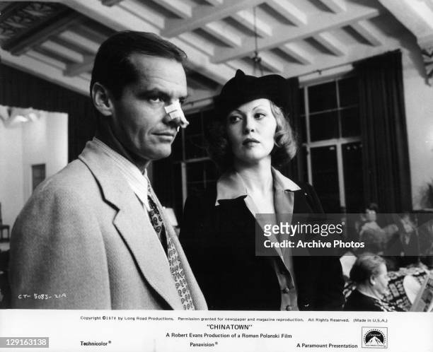 Jack Nicholson and Faye Dunaway standing in restaurant in a scene from the film 'Chinatown', 1974.