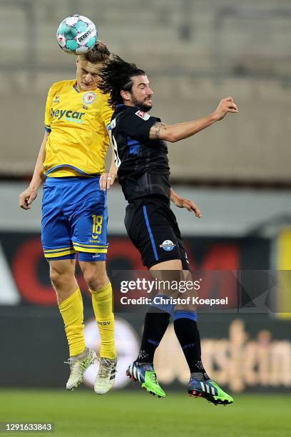 Felix Kroos of Braunschweig and Marco Terrazzino of Paderborn go up for a header the Second Bundesliga match between SC Paderborn 07 and Eintracht...