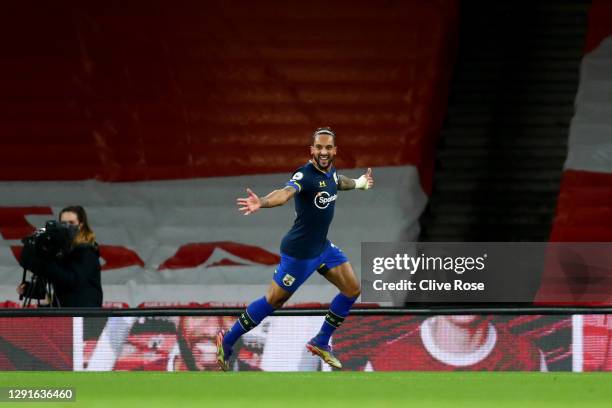 Theo Walcott of Southampton celebrates after scoring their team's first goal during the Premier League match between Arsenal and Southampton at...