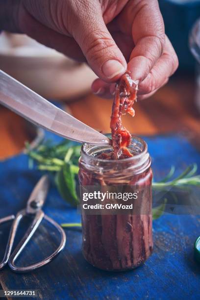 canned anchovy fish fillet in a glass - anchova imagens e fotografias de stock