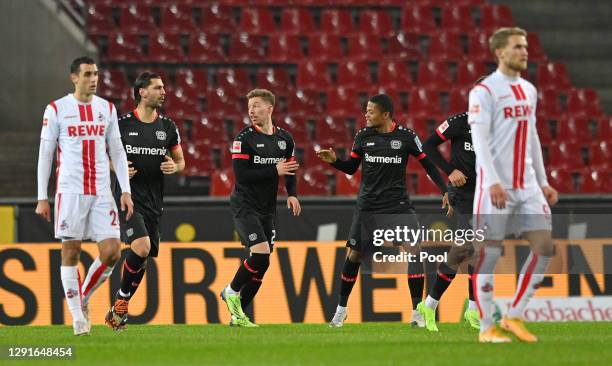 Mitchell Weiser of Bayer Leverkusen celebrates after scoring their team's first goal during the Bundesliga match between 1. FC Koeln and Bayer 04...