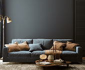 Modern home interior mock-up with dark blue sofa, table and decor in living room