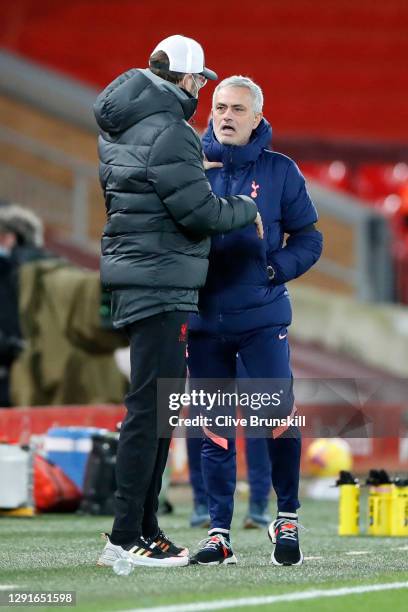 Jose Mourinho, Manager of Tottenham Hotspur talks to Jurgen Klopp, Manager of Liverpool prior to the Premier League match between Liverpool and...