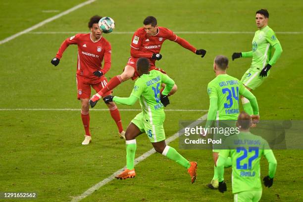 Robert Lewandowski of Bayern Munich scores their team's first goal during the Bundesliga match between FC Bayern Muenchen and VfL Wolfsburg at...