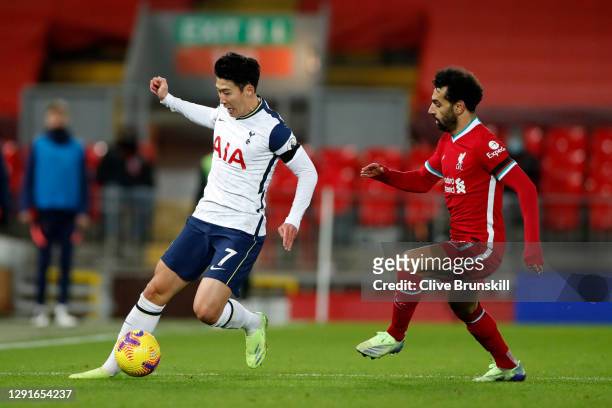 Son Heung-Min of Tottenham Hotspur battles for possession with Mohamed Salah of Liverpool during the Premier League match between Liverpool and...