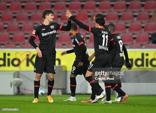 Patrik Schick of Bayer Leverkusen celebrates with Nadiem Amiri and teammates after scoring their team's third goal during the Bundesliga match...