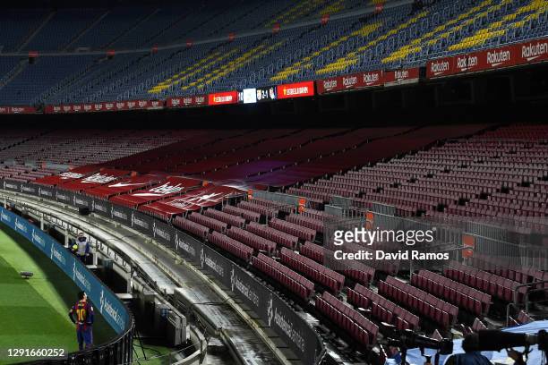 Lionel Messi of Barcelona looks to the empty stands during the La Liga Santander match between FC Barcelona and Real Sociedad at Camp Nou on December...