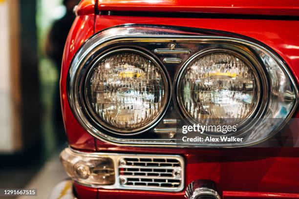 red vintage car headlights - radiator grille stock pictures, royalty-free photos & images