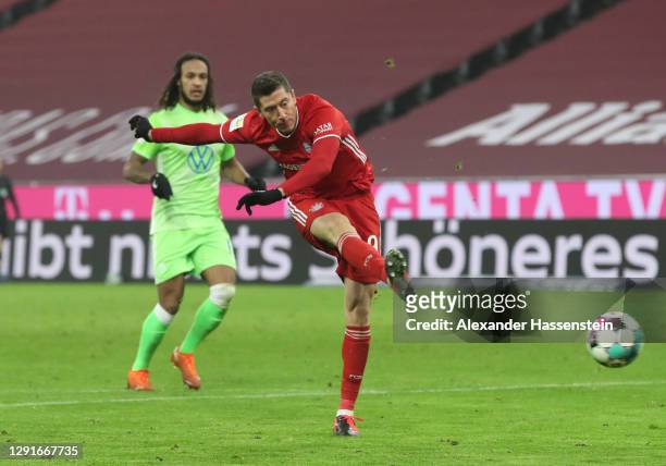 Robert Lewandowski of Bayern Munich scores their team's second goal during the Bundesliga match between FC Bayern Muenchen and VfL Wolfsburg at...