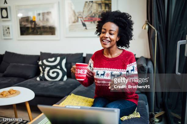 young happy african american woman working from home - virtual vacations stock pictures, royalty-free photos & images