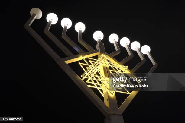huge hanukkah candle holder (menorah) viewed from below in berlin, germany. - judenstern stock-fotos und bilder