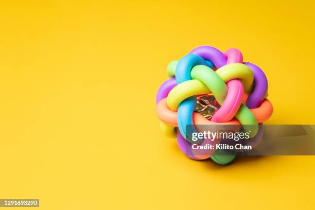 intertwined multi-color ball - incrociare foto e immagini stock