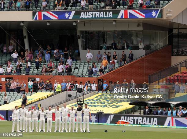 Australian players pause during day one of the First Test match between Australia and India at Adelaide Oval on December 17, 2020 in Adelaide,...
