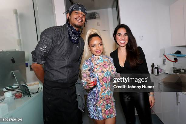 Chef Roblé Ali, Mapy, and Dr. Mahvish Ahmed attend a holiday party hosted by Dr. Lee Gause on December 16, 2020 in New York City.