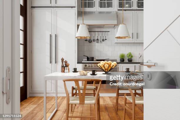 modern kitchen interior with wooden chairs, pendant lights, marble table and opened door into the kitchen. - new flooring stock pictures, royalty-free photos & images
