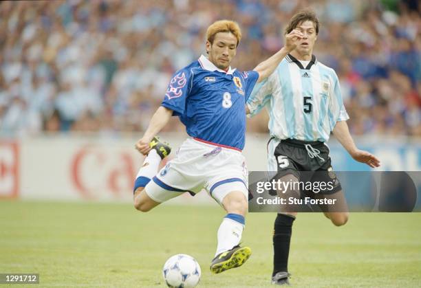 Hidetoshi Nakata of Japan shapes to shoot during the World Cup group H game against Argentina at the Stade Municipal in Toulouse, France. Argentina...