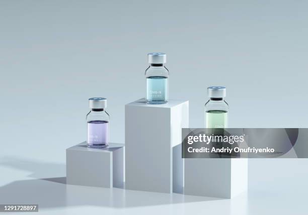 covid-19 vaccine bottles on cubes - choice prize stock pictures, royalty-free photos & images