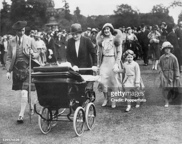 The Duke and Duchess of York, later Queen Elizabeth and King George VI , attend a garden party at Glamis Castle in Angus, Scotland, to celebrate the...