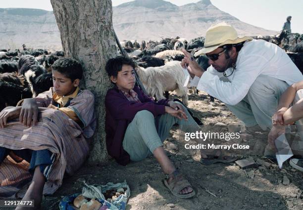 Mexican director Alejandro Gonzalez Inarritu with local actors Boubker Ait El Caid and Said Tarchani during the filming of 'Babel' on location in...