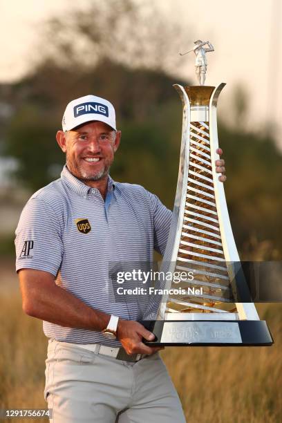 Lee Westwood of England celebrates with the Race to Dubai Trophy following Day Four of the DP World Tour Championship at Jumeirah Golf Estates on...