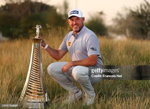 Lee Westwood of England celebrates with the Race to Dubai Trophy following Day Four of the DP World Tour Championship at Jumeirah Golf Estates on...