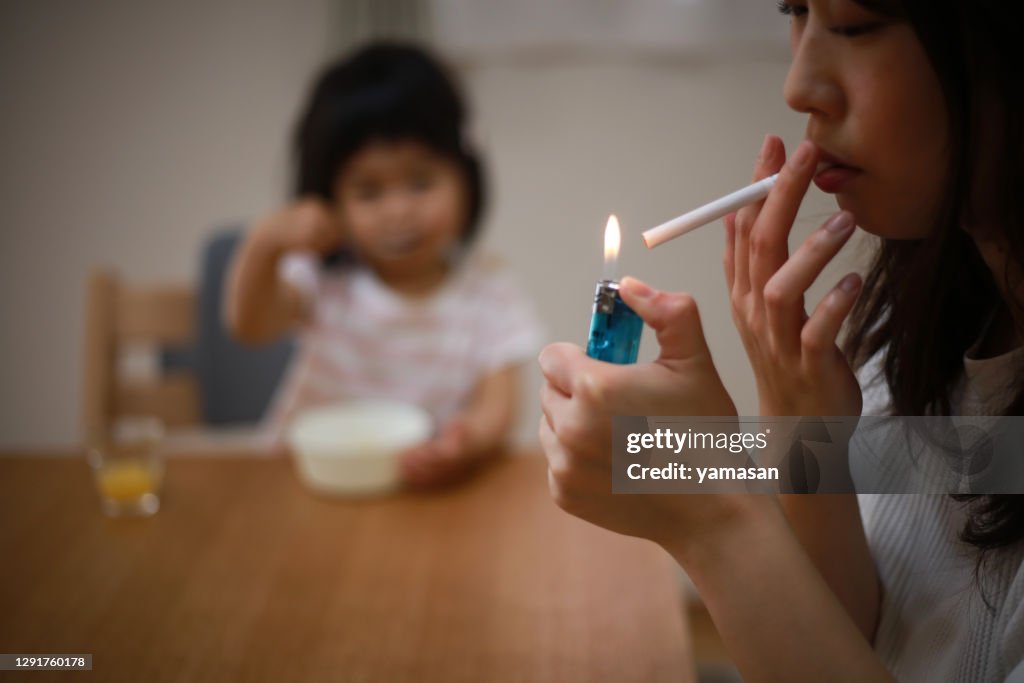 Mother smoking near children