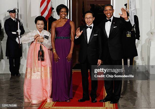 Republic of Korea first lady Kim Yoon-ok, U.S. First lady Michele Obama, South Korean President Lee Myung-bak and U.S. President Barack Obama pose...