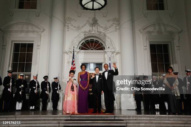 South Korean first lady Kim Yoon-ok, U.S. First lady Michele Obama, South Korean President Lee Myung-bak and U.S. President Barack Obama pose for...