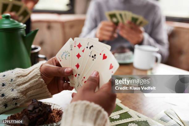 friends playing cards in camper van - playing card stock pictures, royalty-free photos & images